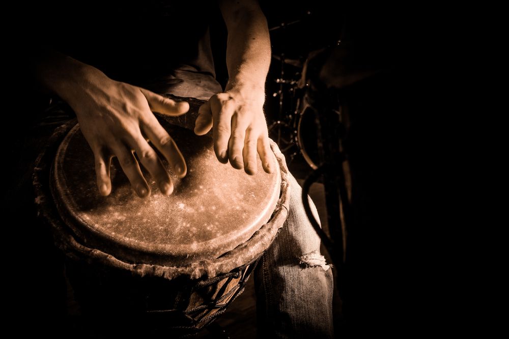 Hands-beating-on-a-drum