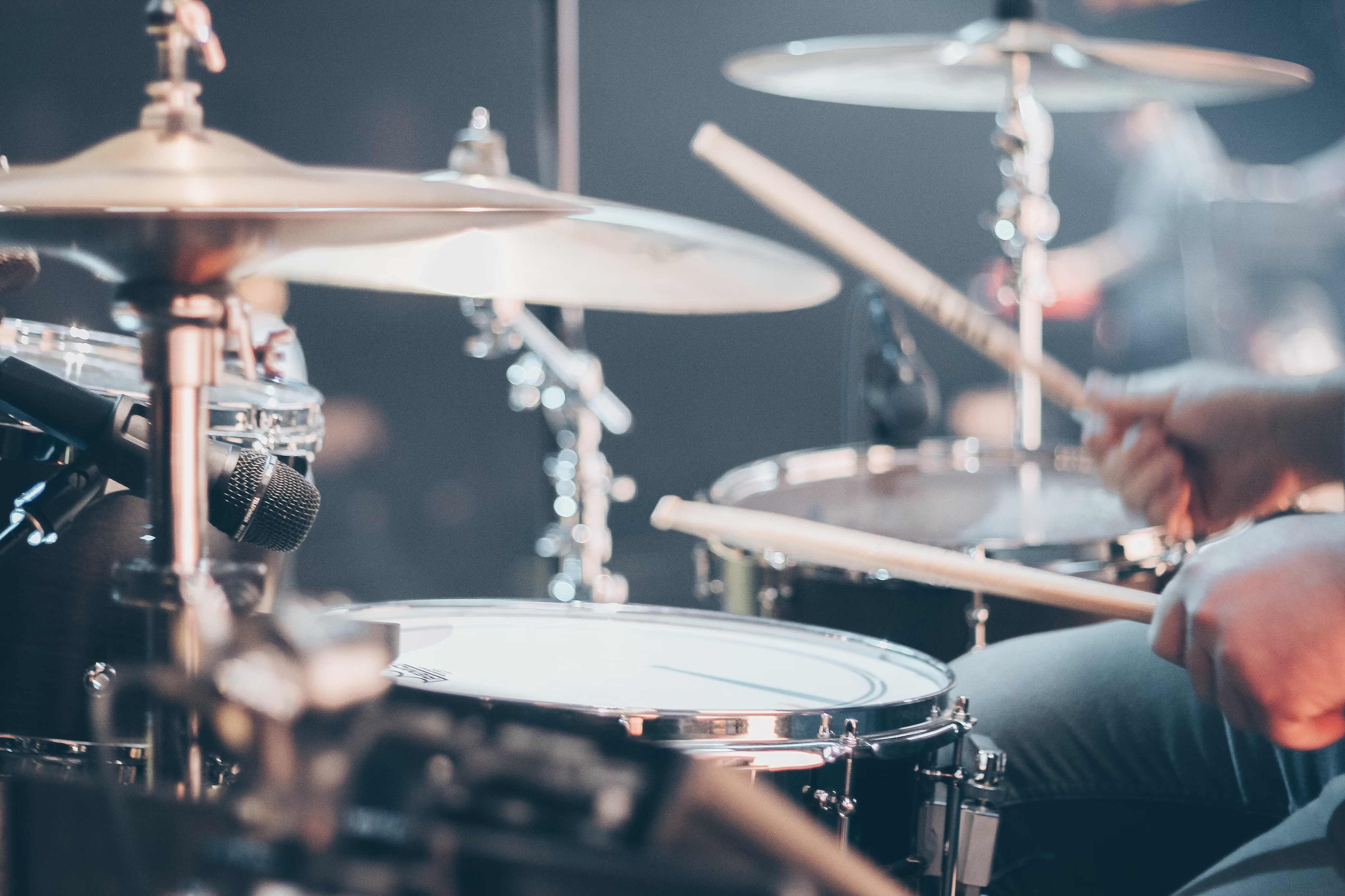 Close up of a microphone on a drum kit recording music to be featured in Soundstripe's enterprise plan