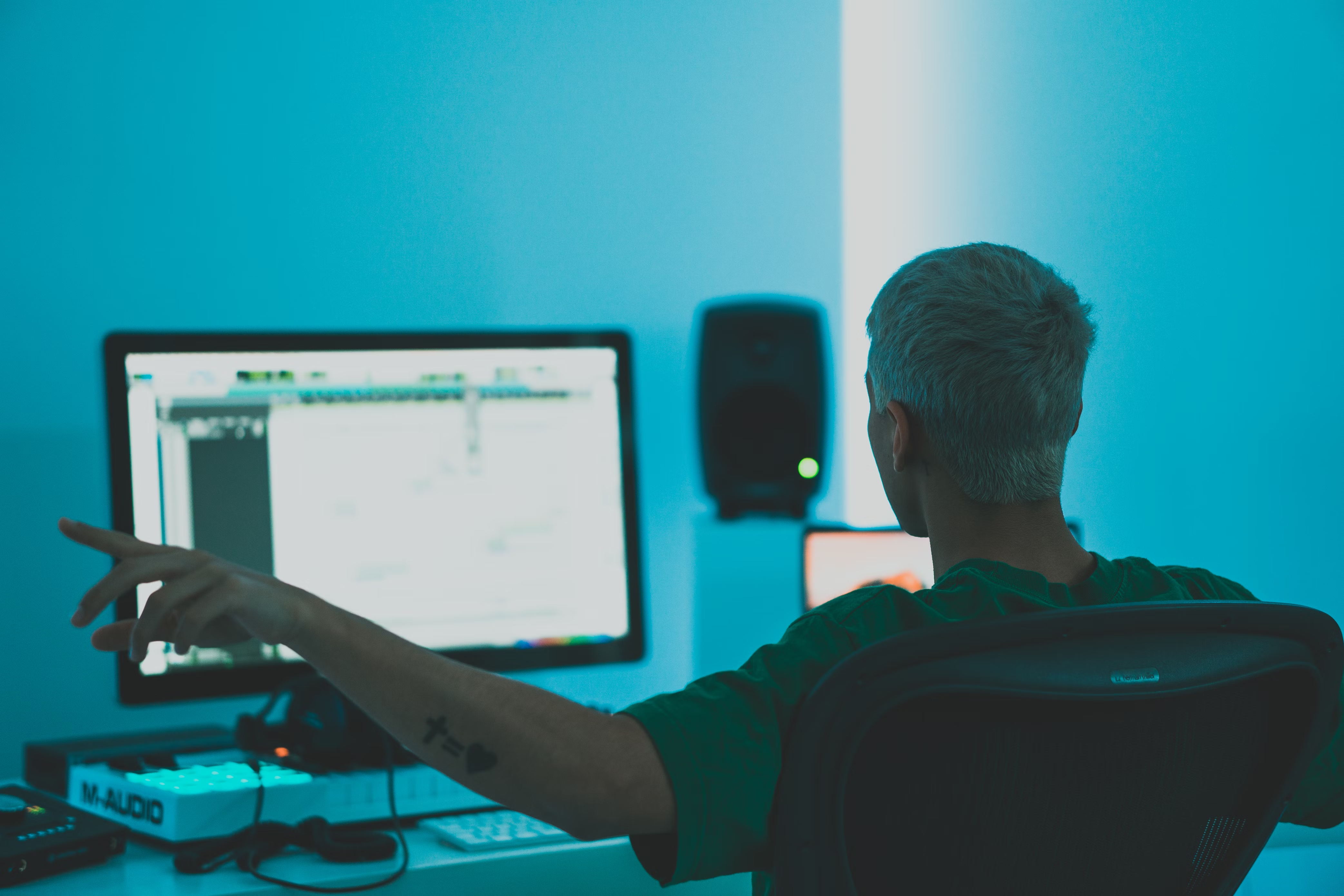 Man at computer working on a music licensing agreement