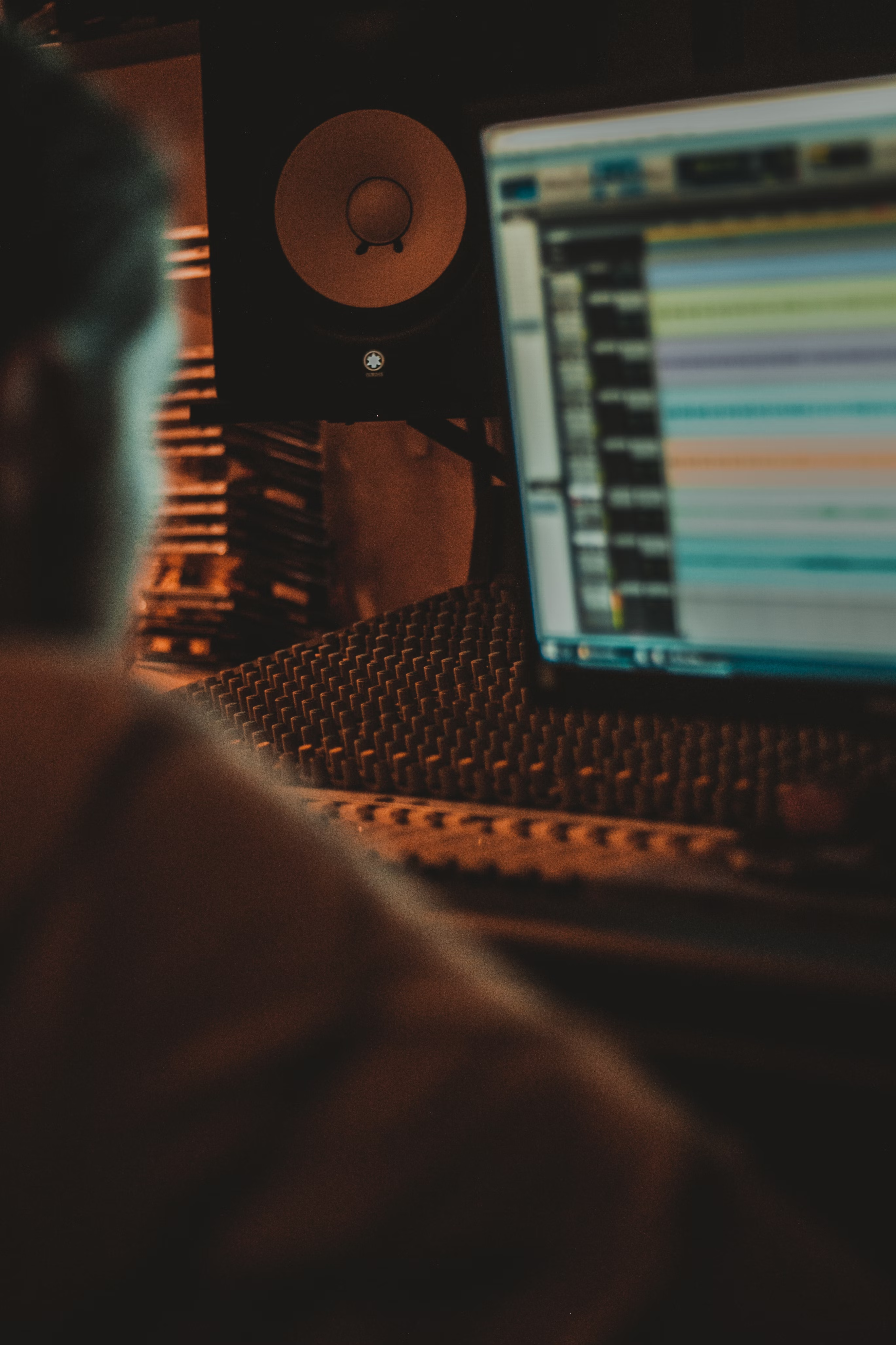 Close up of person sitting at a computer learning about the 4 types of music royalties